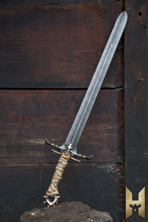 Marauder Sword displayed against a rustic backdrop, featuring a sleek blade and intricately designed hilt.