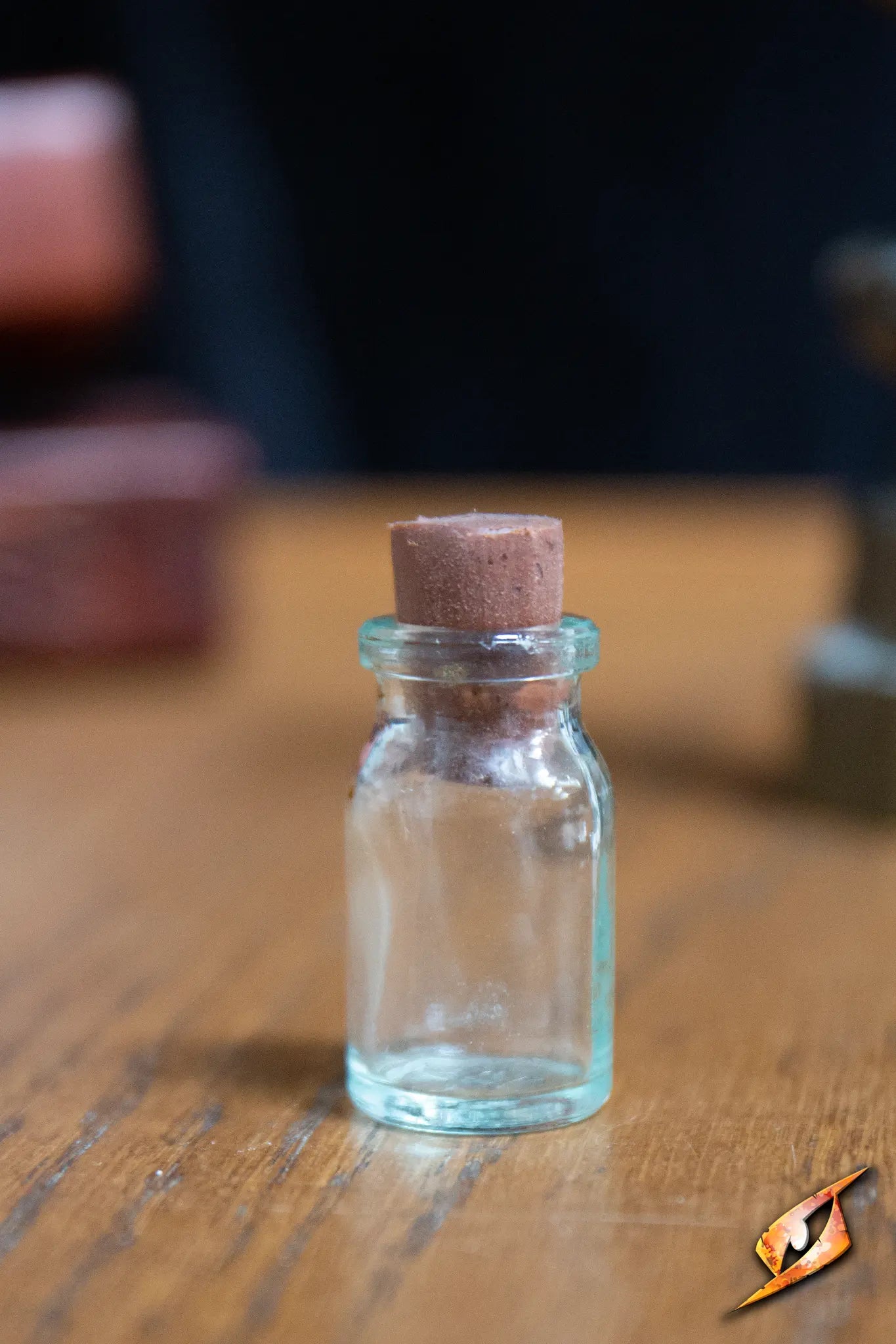 Potion Flask Small displayed on a wooden surface, featuring a cork stopper in its opening.