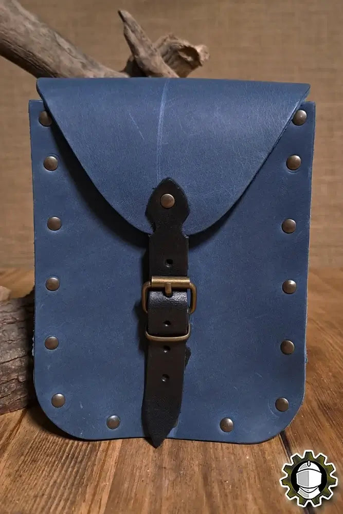 Beltbag Jerome (New Blood) made from durable blue leather with brass studs and buckle closure.
