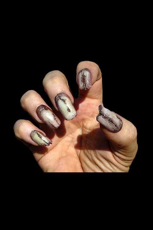 Creepy Claws - Undead nail design featuring gruesome and spooky effects on long nails.