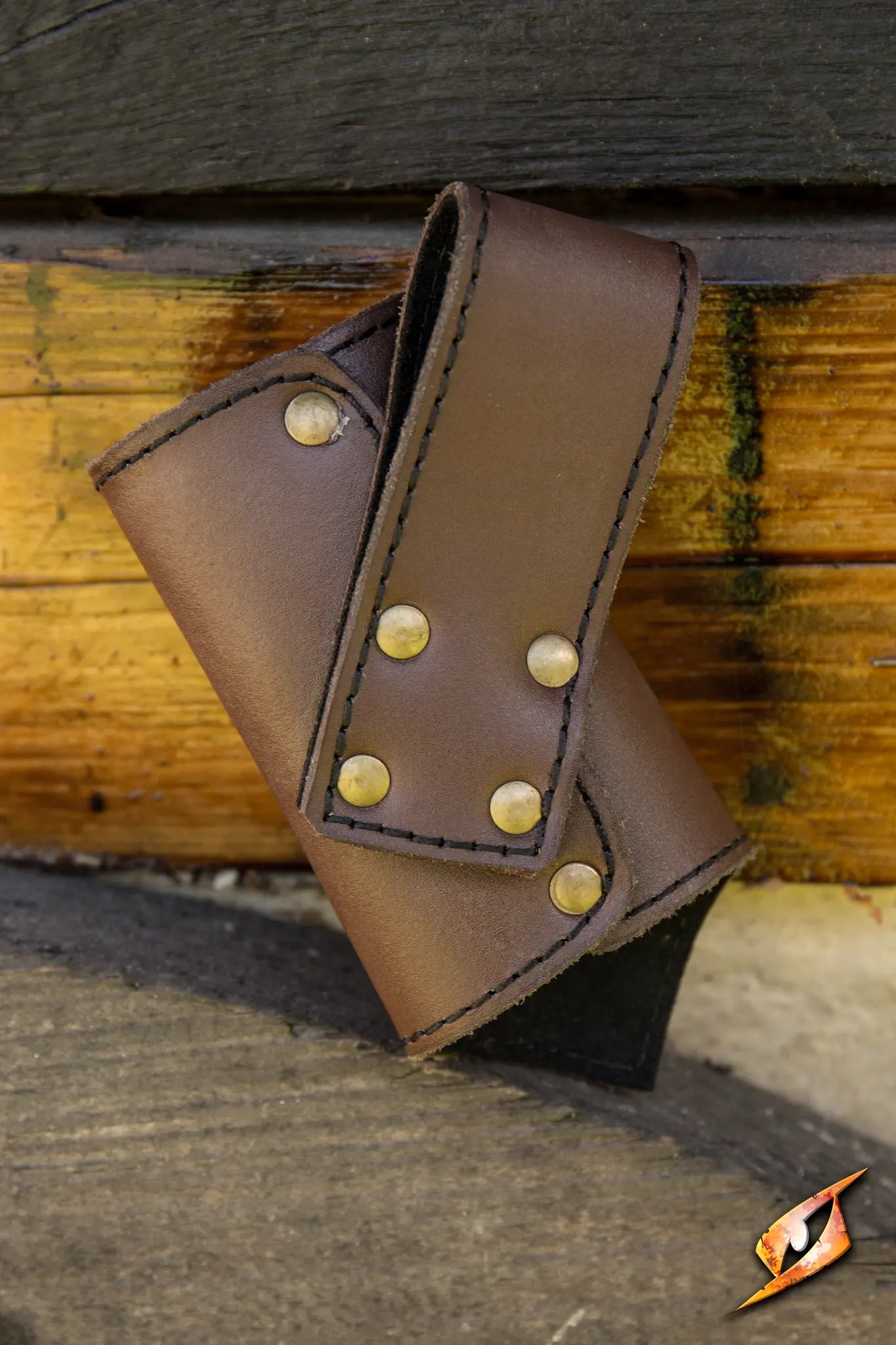 Brown leather Sword Holder with brass studs, designed for secure weapon storage and easy access during adventures.