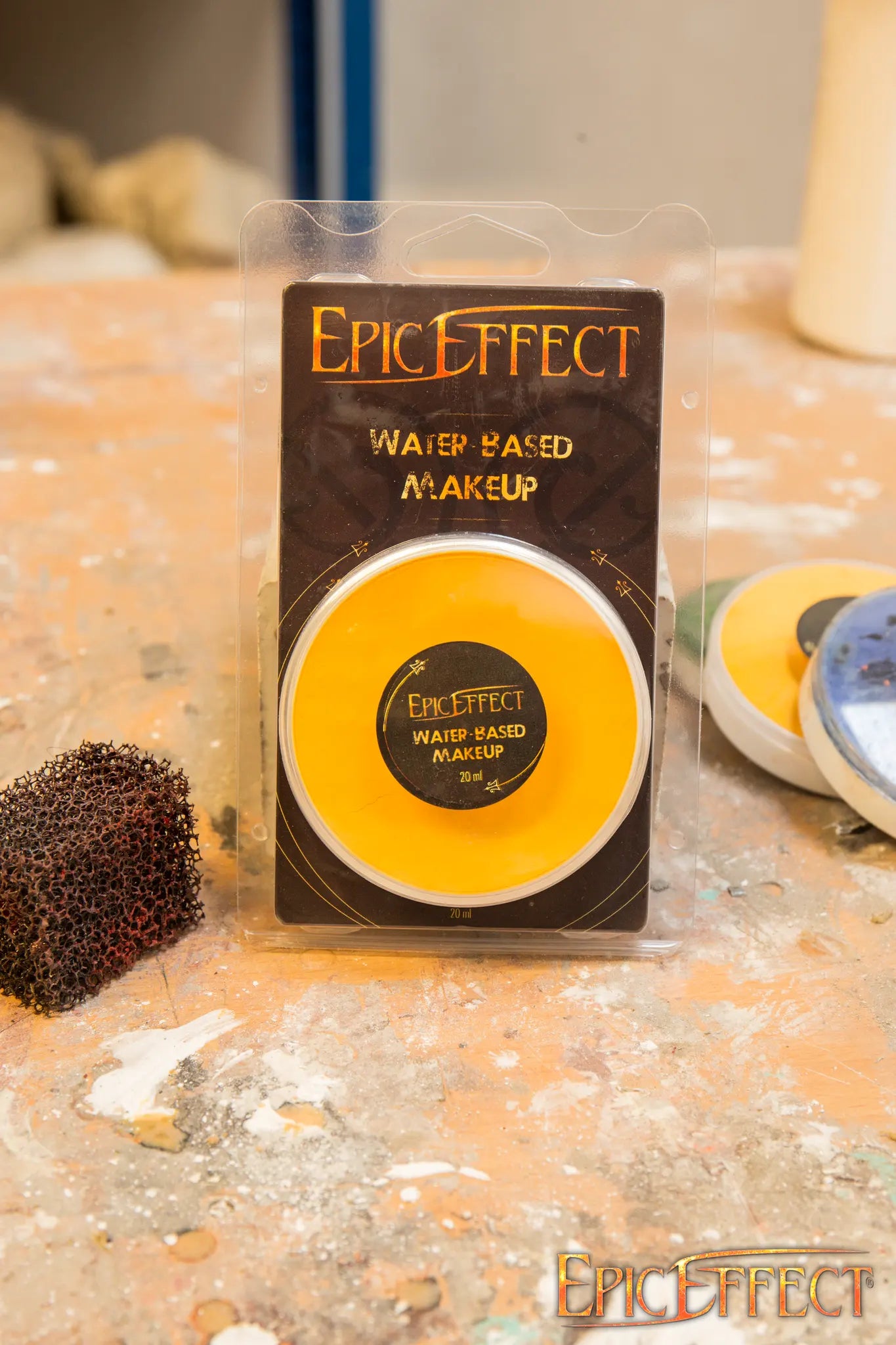 Water Based Make Up - Yellow by Epic Effects in a compact container on a work surface.