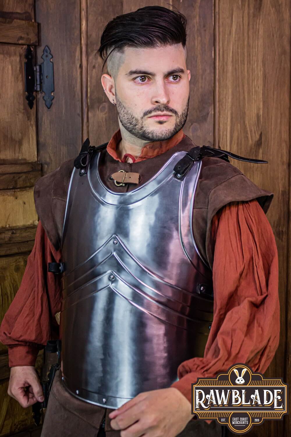 Alonso Cuirass worn by a model, showcasing its layered iron design and leather straps from Rawblade.
