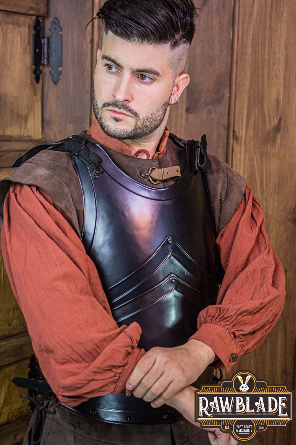 Alonso Cuirass displayed by a model, showcasing the detailed iron breastplate and leather straps from Rawblade.