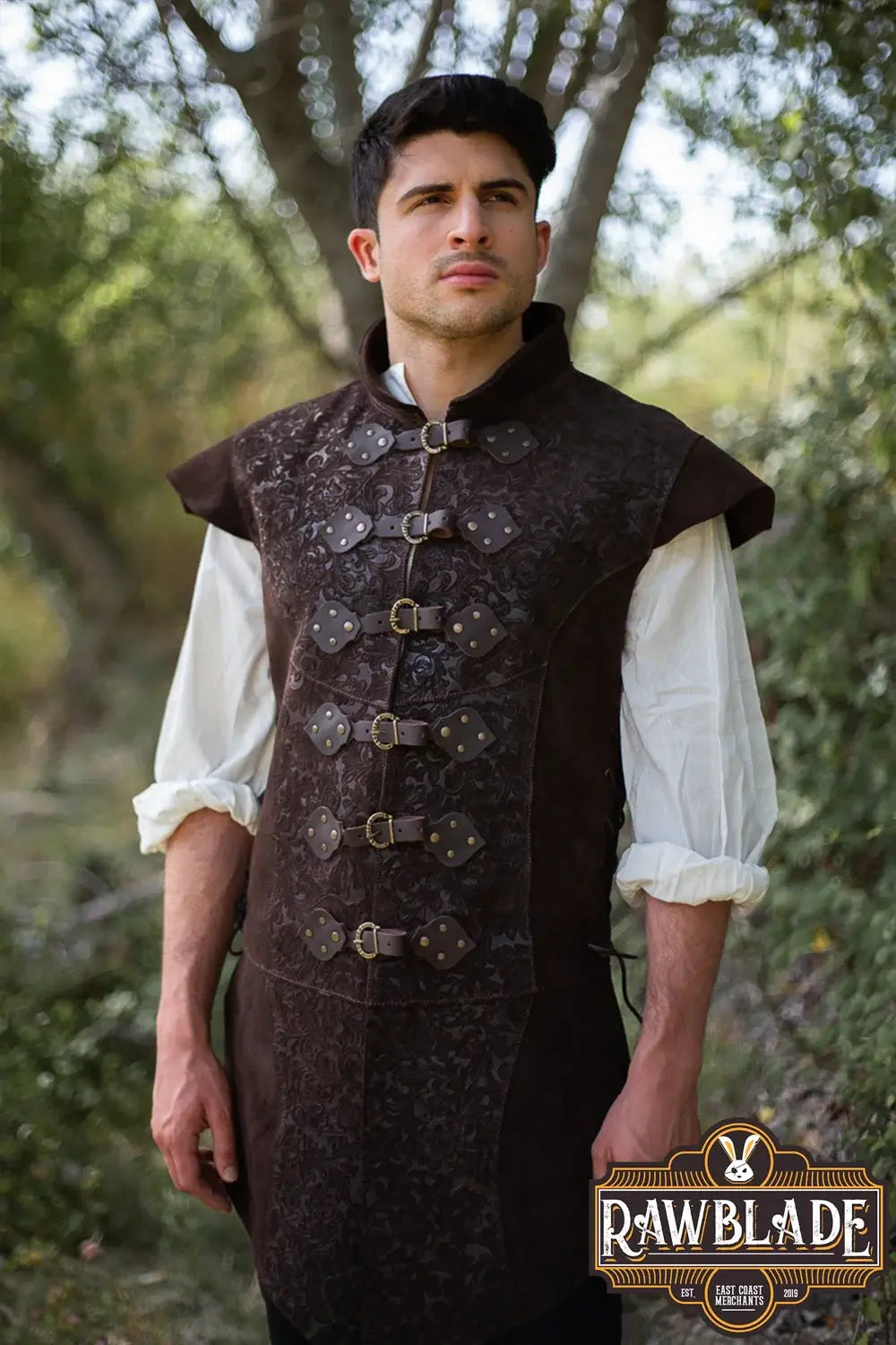 Yalon Long Jerkin Deluxe worn by a model in an outdoor setting, showcasing leather design details.