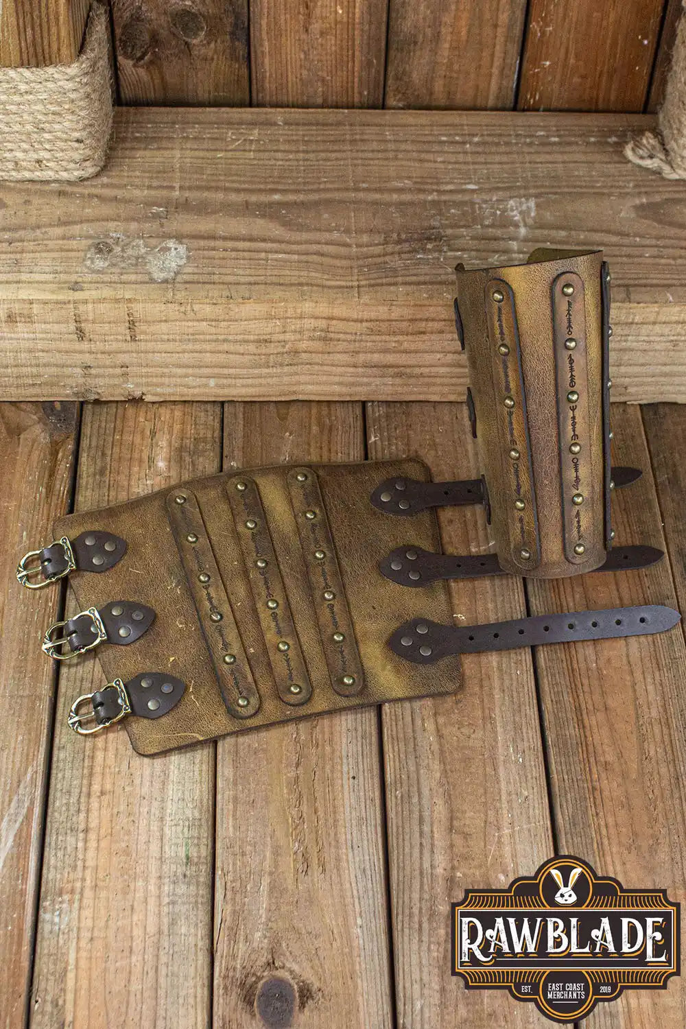 Hirdman Bracers leather bracelets with engraved straps and studs for medieval fairs and LARP events.