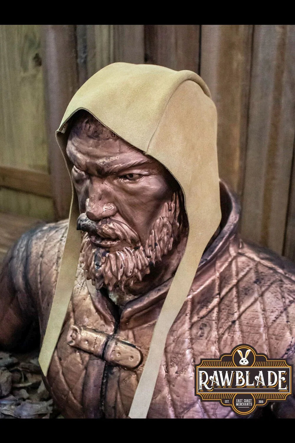 Barbadok Leather Coif displayed on a statue, showcasing high-quality split leather and long chin straps.