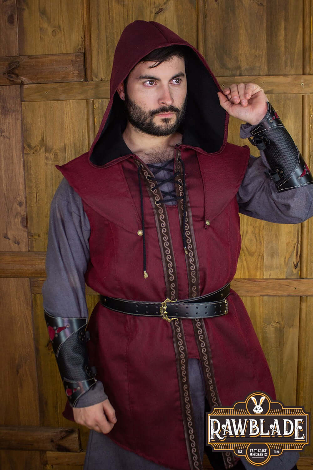 Karanthir Tunic worn by a model, featuring a wide hood and stylish design for wizards and adventurers.
