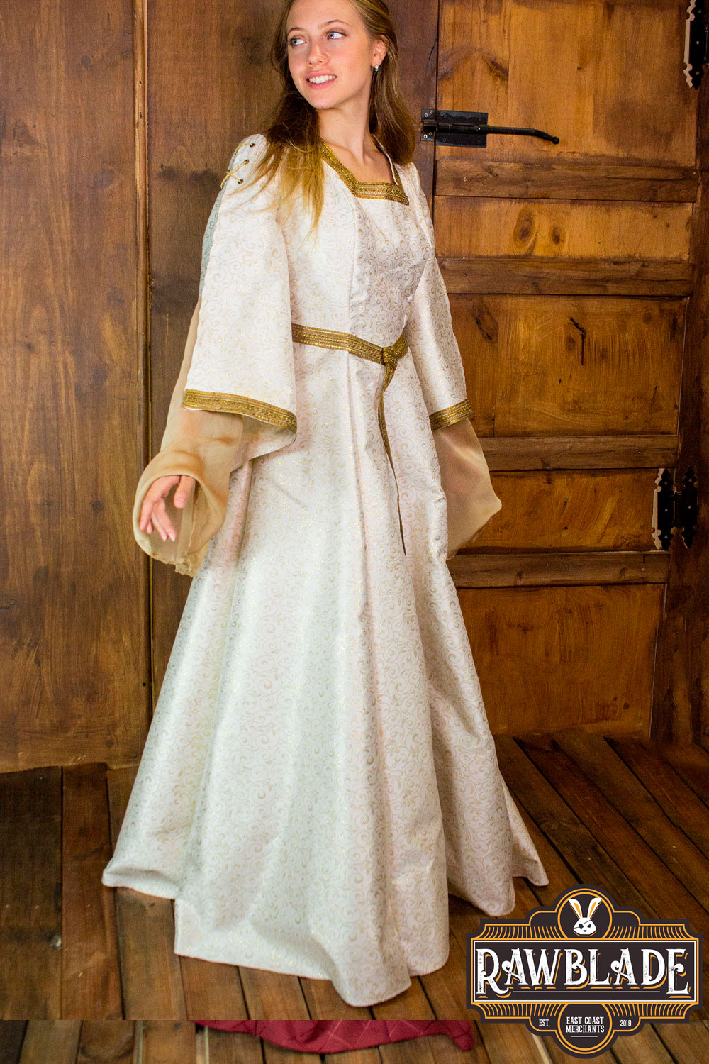 Aquitania Noble Dress in gold brocade with tulle sleeves, showcasing medieval elegance and intricate gold trims.