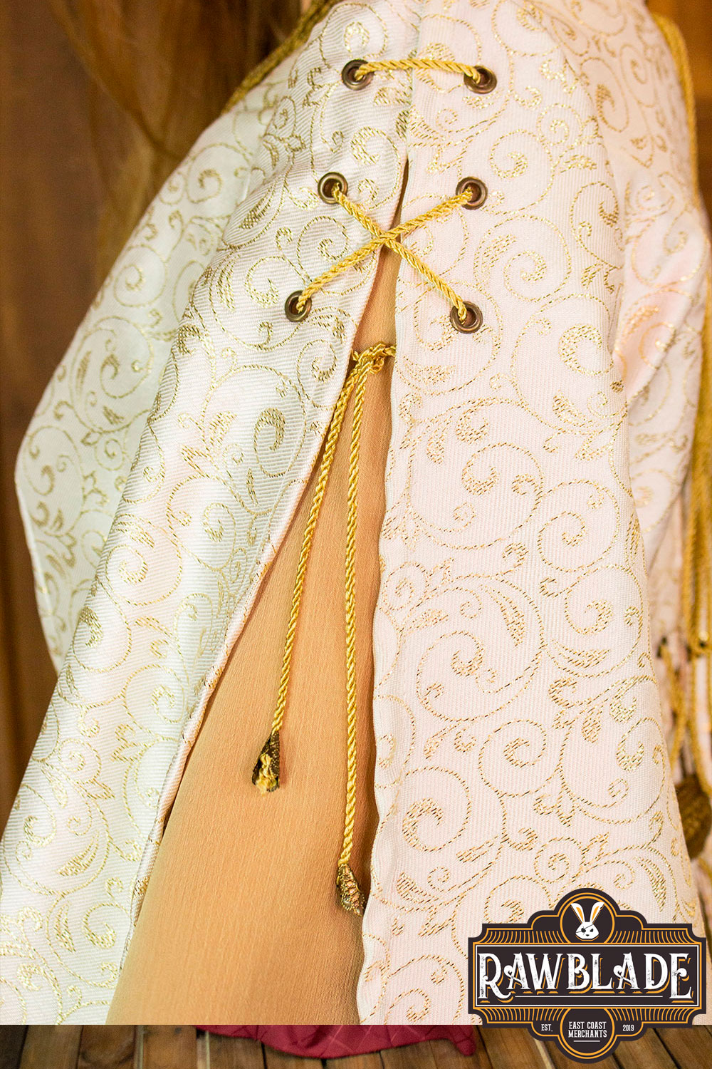 Detail of Aquitania Noble Dress showing intricate gold trims and laces on the sleeves by Rawblade.