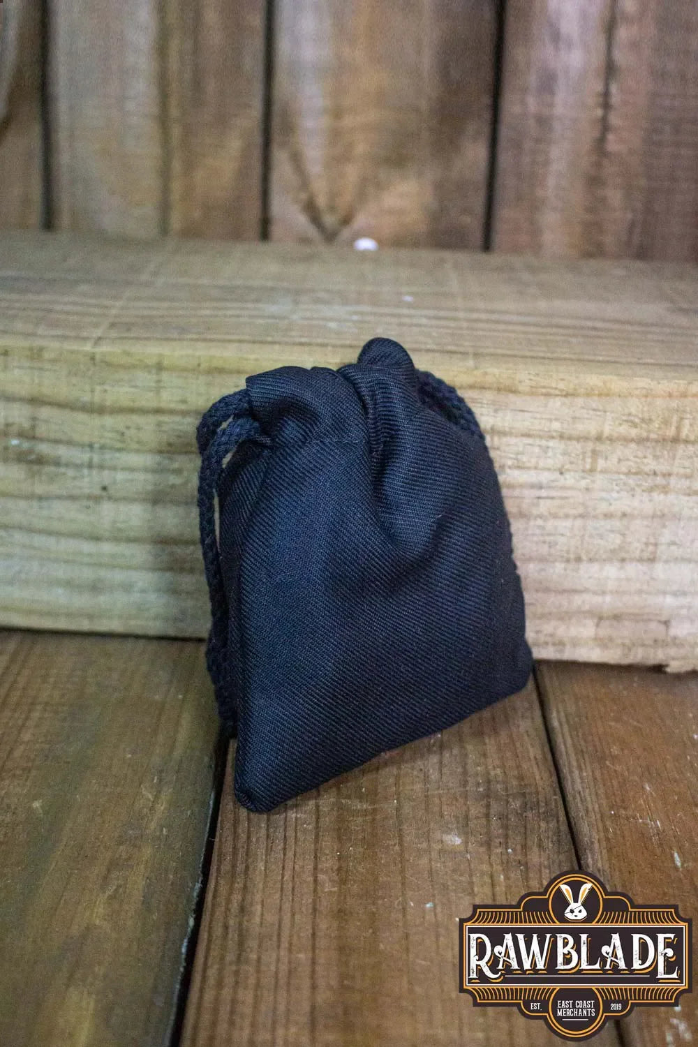 Premium black Timber Pouch Premium on wooden surface, showcasing quality cotton and traditional craftsmanship.