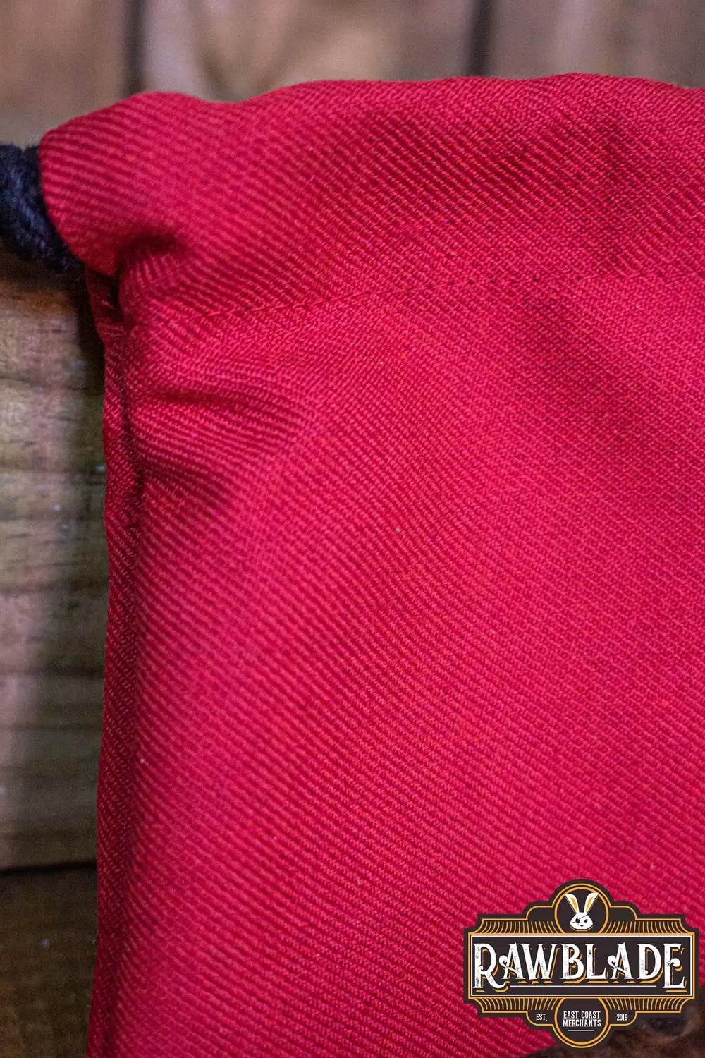 Close-up of the Timber Pouch Premium in red cotton fabric showcasing high-quality craftsmanship.