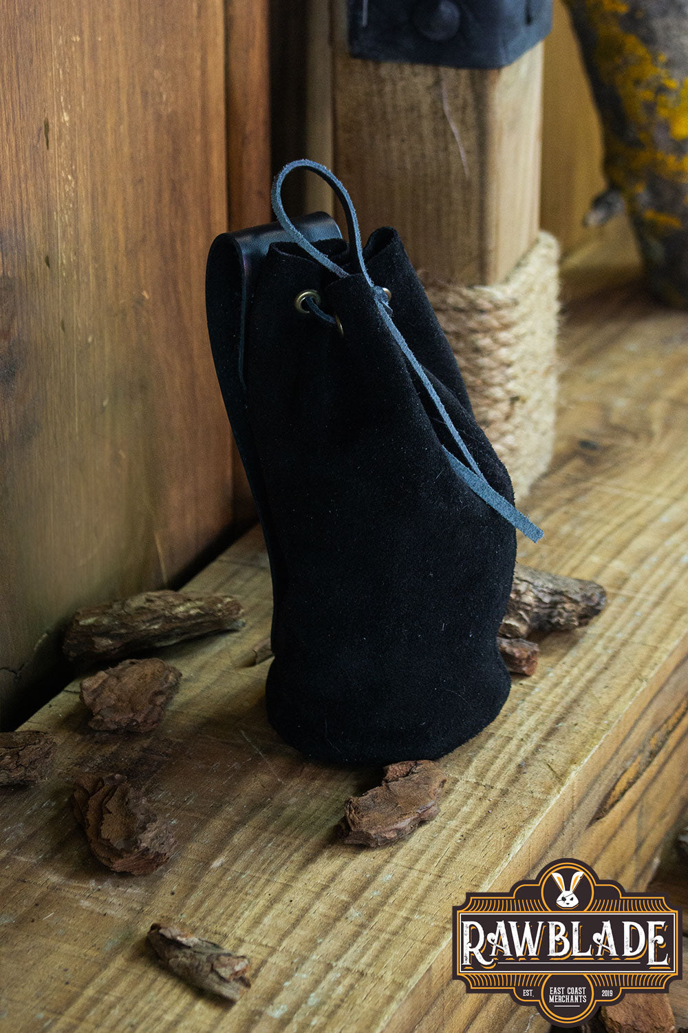 Adventurer Tube Pouch in black suede material, ideal for carrying coins and magic items.