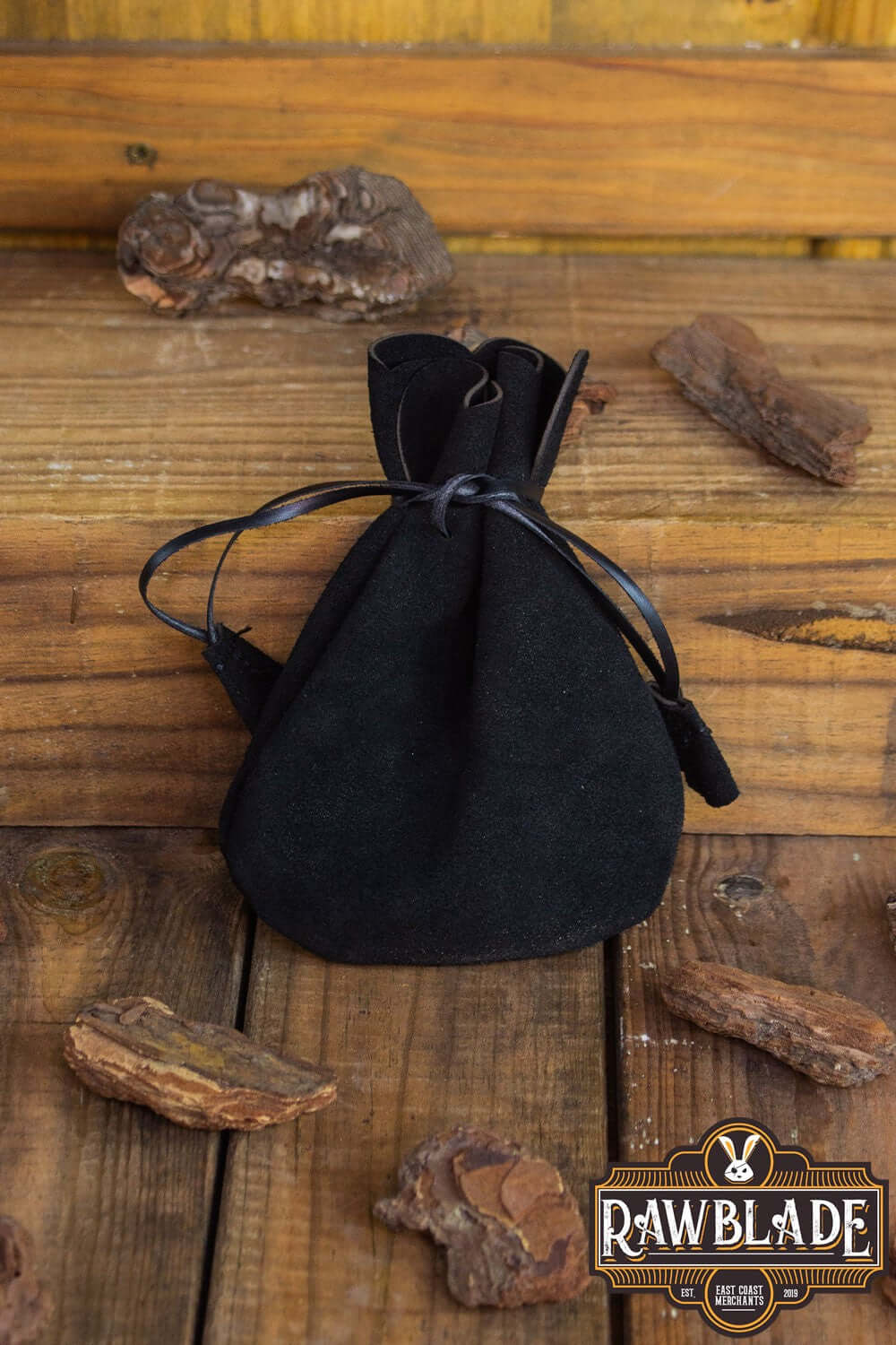 Alentorn Coin Bag made of soft split leather with leather draw strings, perfect for storing valuables.