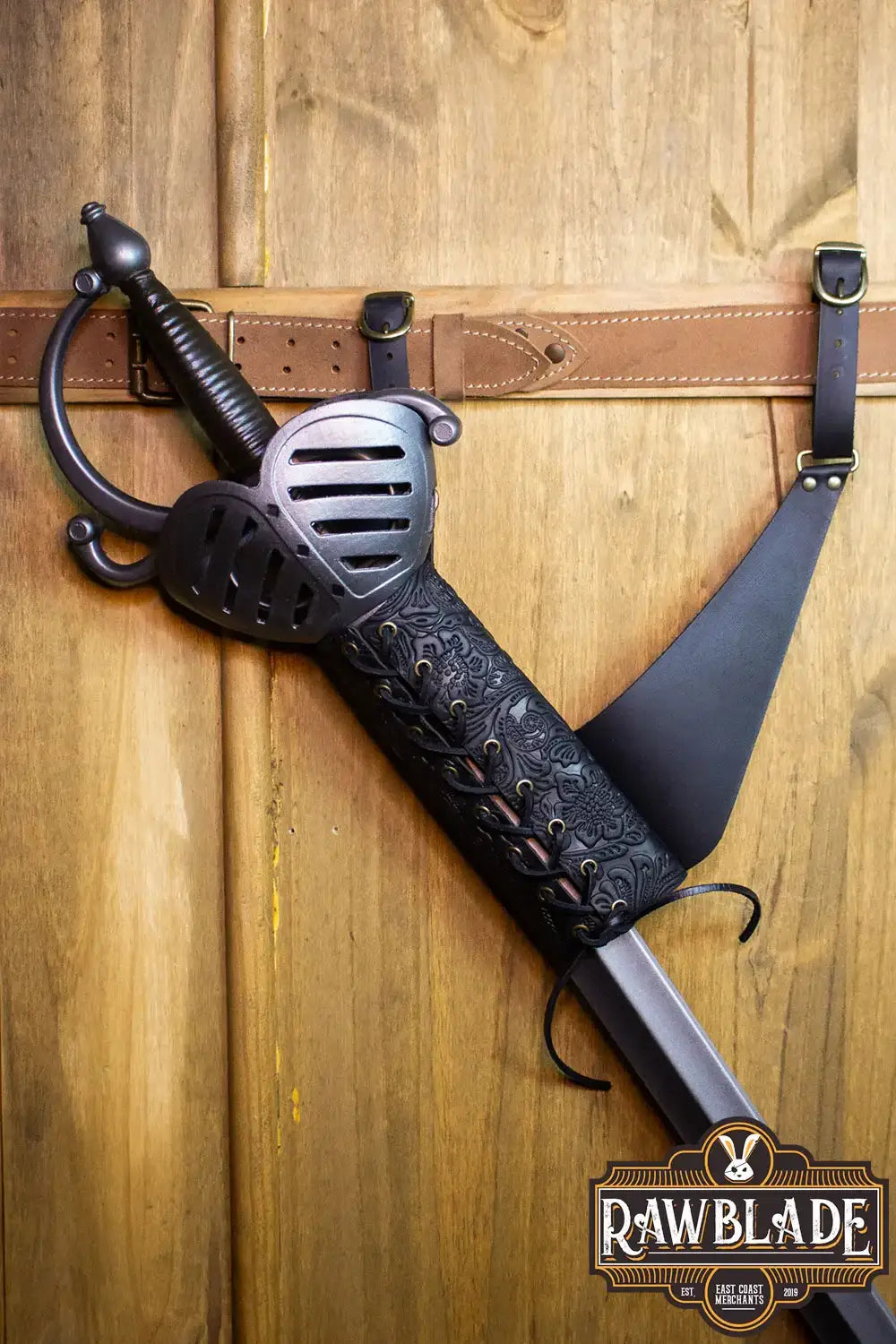 Breda Holder Deluxe attached to a wall, showcasing the high-quality leather and sword fit adjustment features.