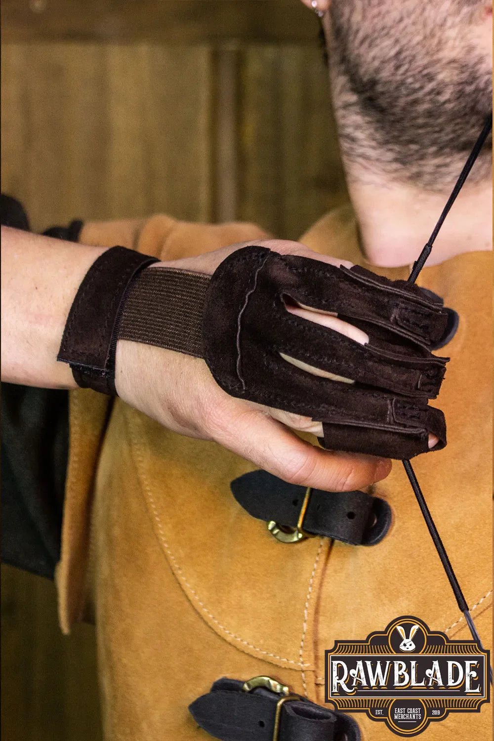 Close-up of Archery Glove Kane on a hand, showcasing high quality leather and adjustable wrist.