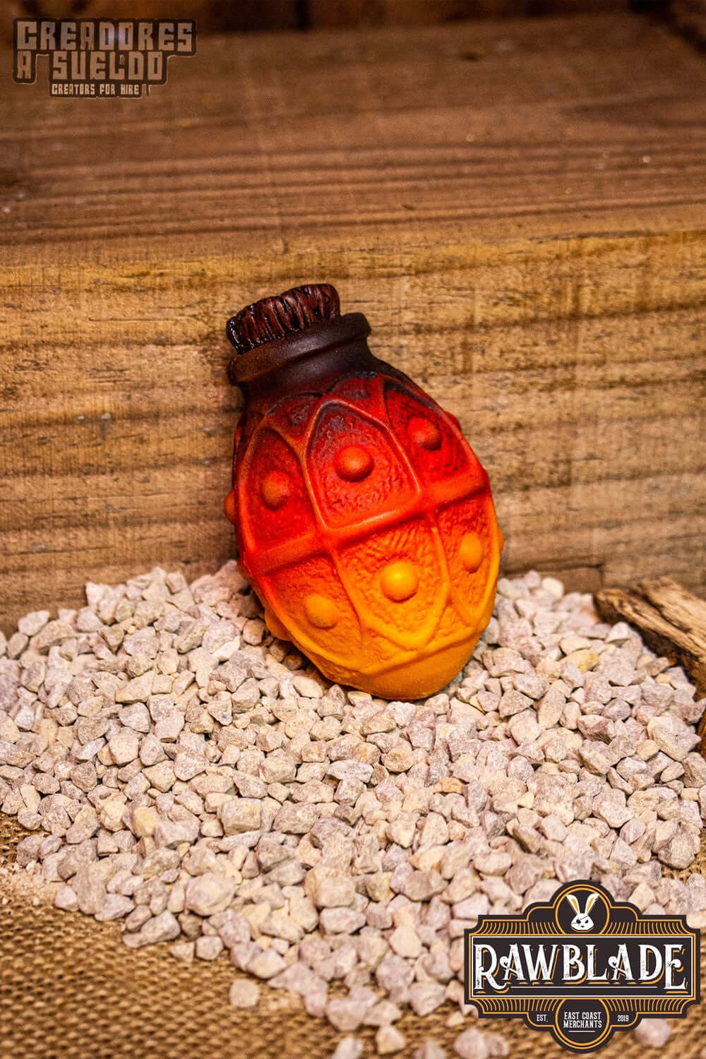 Alchemical Crock in orange and red colors, a throwing weapon designed for alchemists and mages.