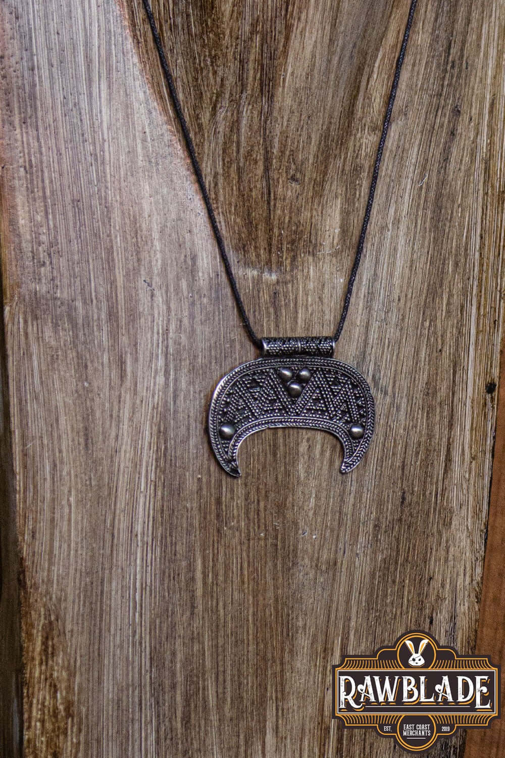 Lunula Chieftain Pendant on a cord, made from durable metal alloy, ideal for minimalist jewellery enthusiasts.