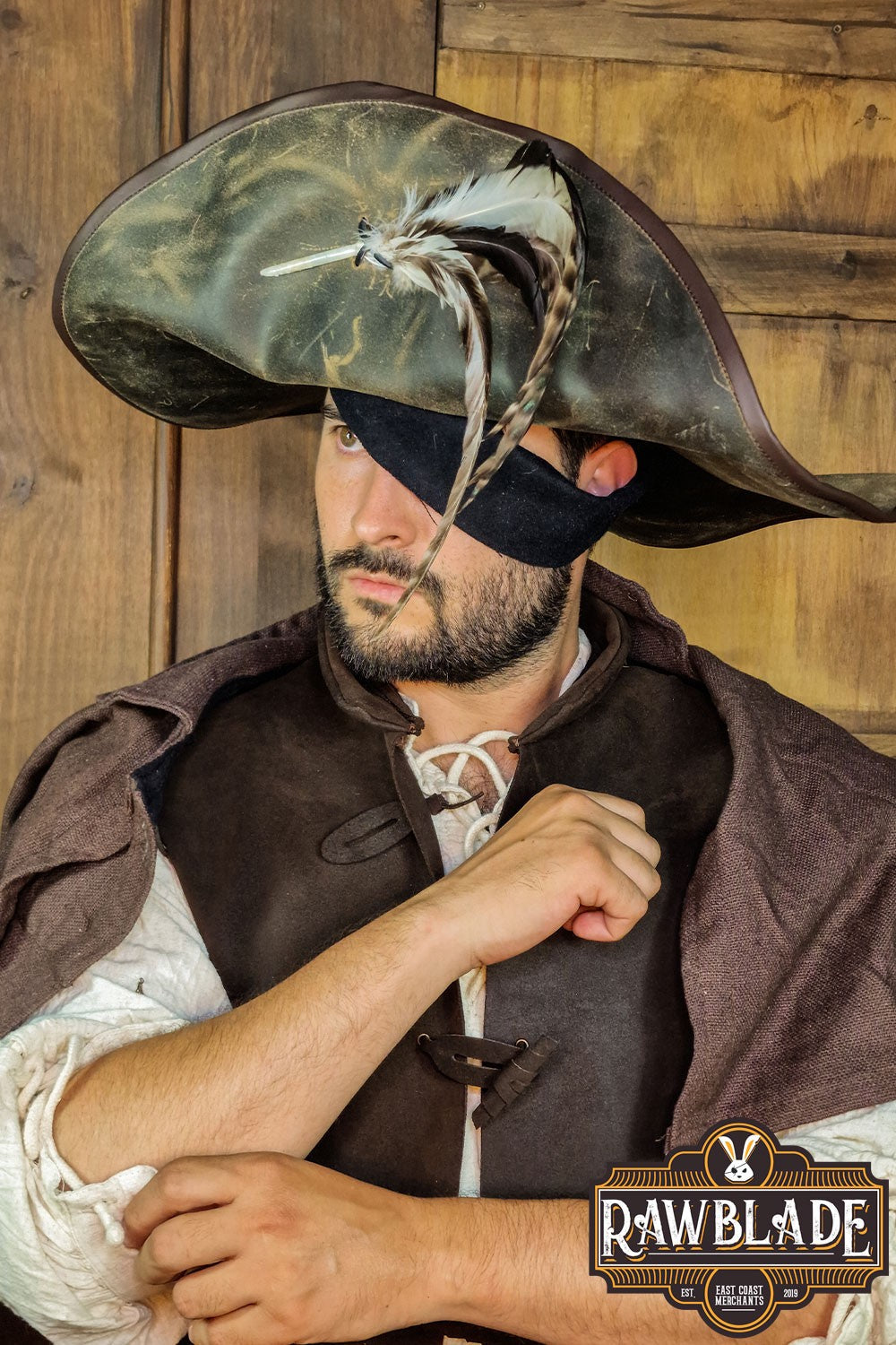 Model wearing Captain Teague Hat with Feathers, showcasing its authentic pirate design and feather detail.