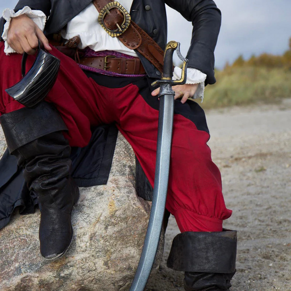 Curved Cores: A pirate dressed in classic attire, sitting on a rock with a sword and relaxed pose.