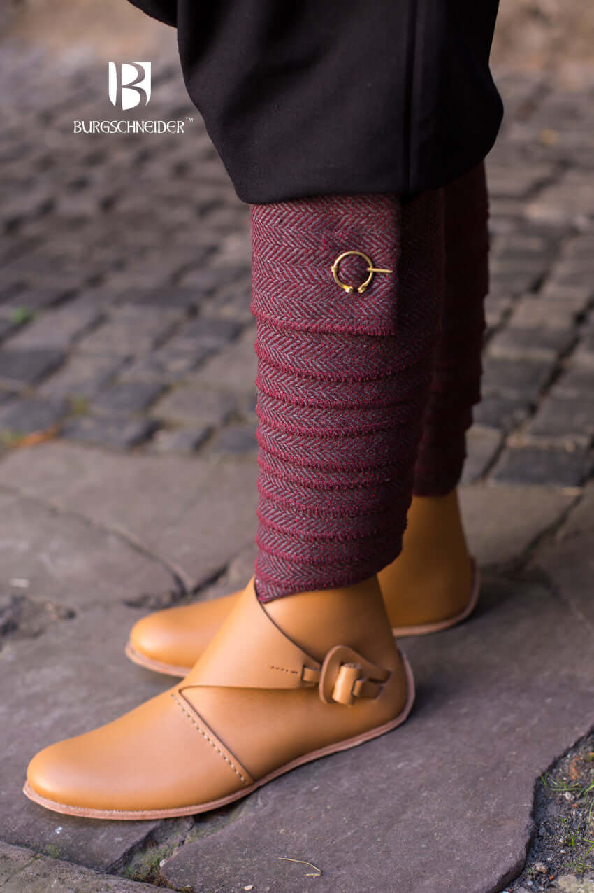Winingas Asgar Herringbone in wool by Burgschneider, styled with brown shoes on cobblestone.