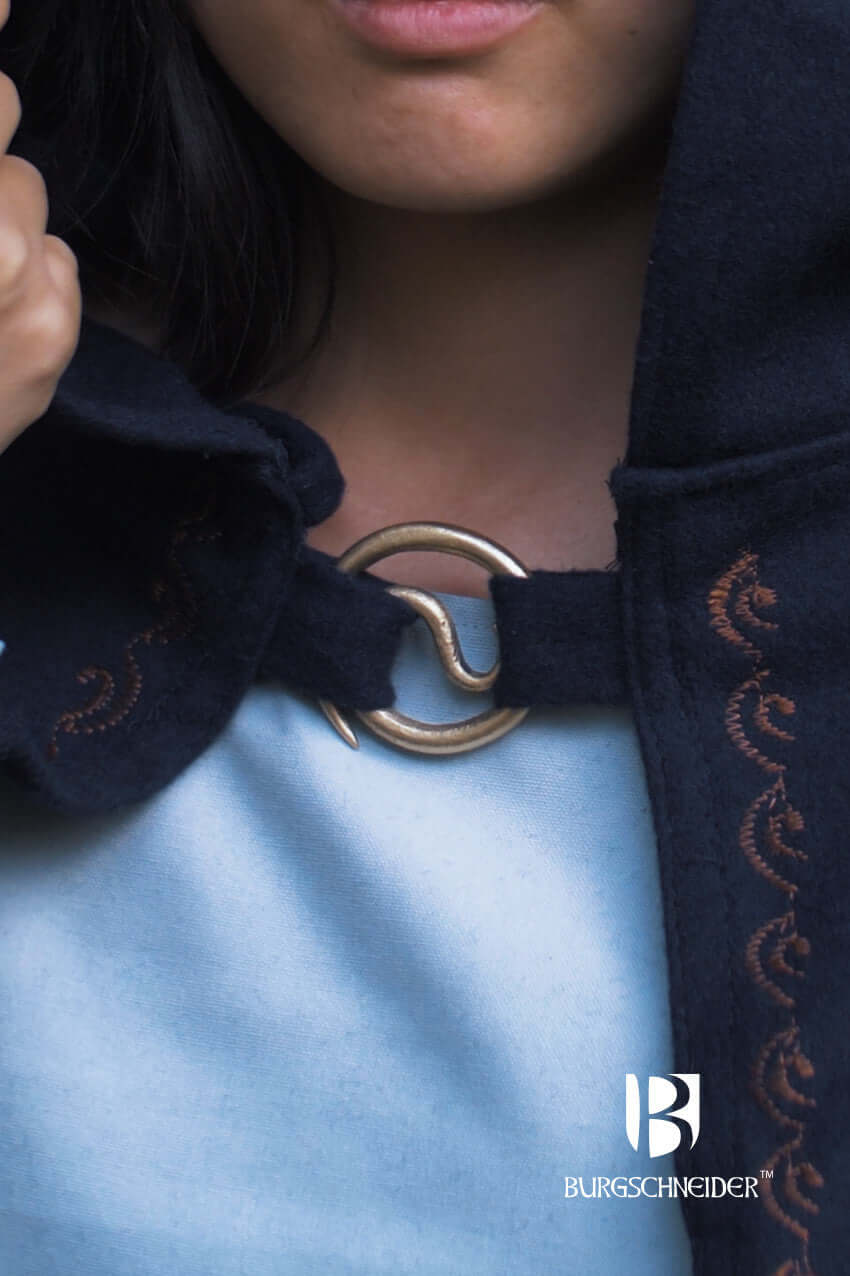 Brooch Spiral Brooch Lukk securing a cloak, featuring a unique spiral design by Burgschneider.