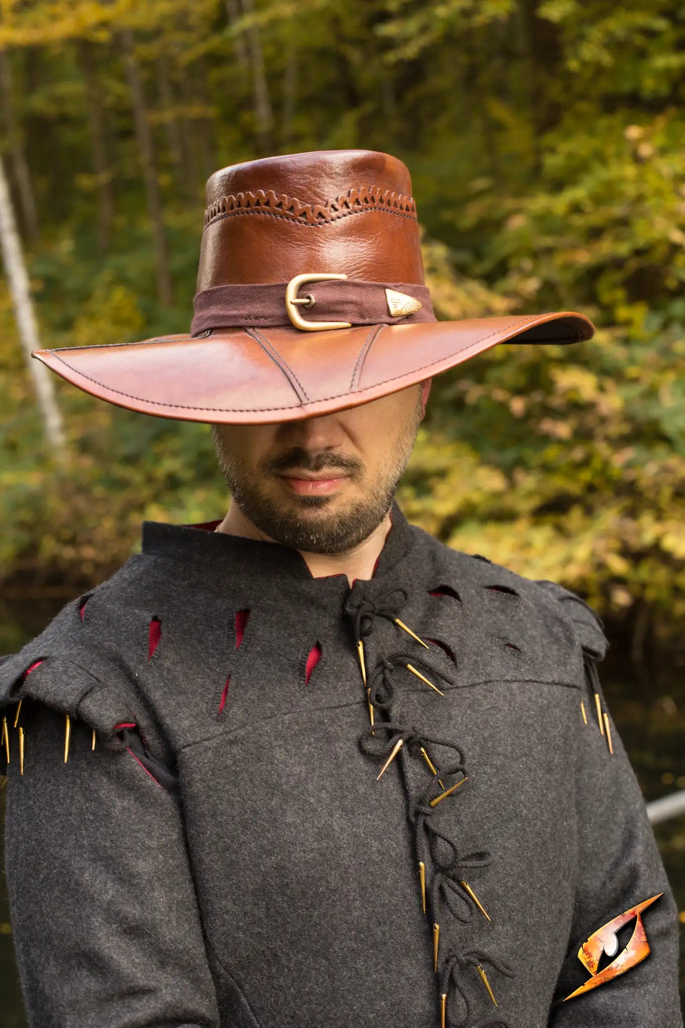 Witch Hunter Hat in ox brown leather, featuring a cotton canvas band and pentagram embellishment.