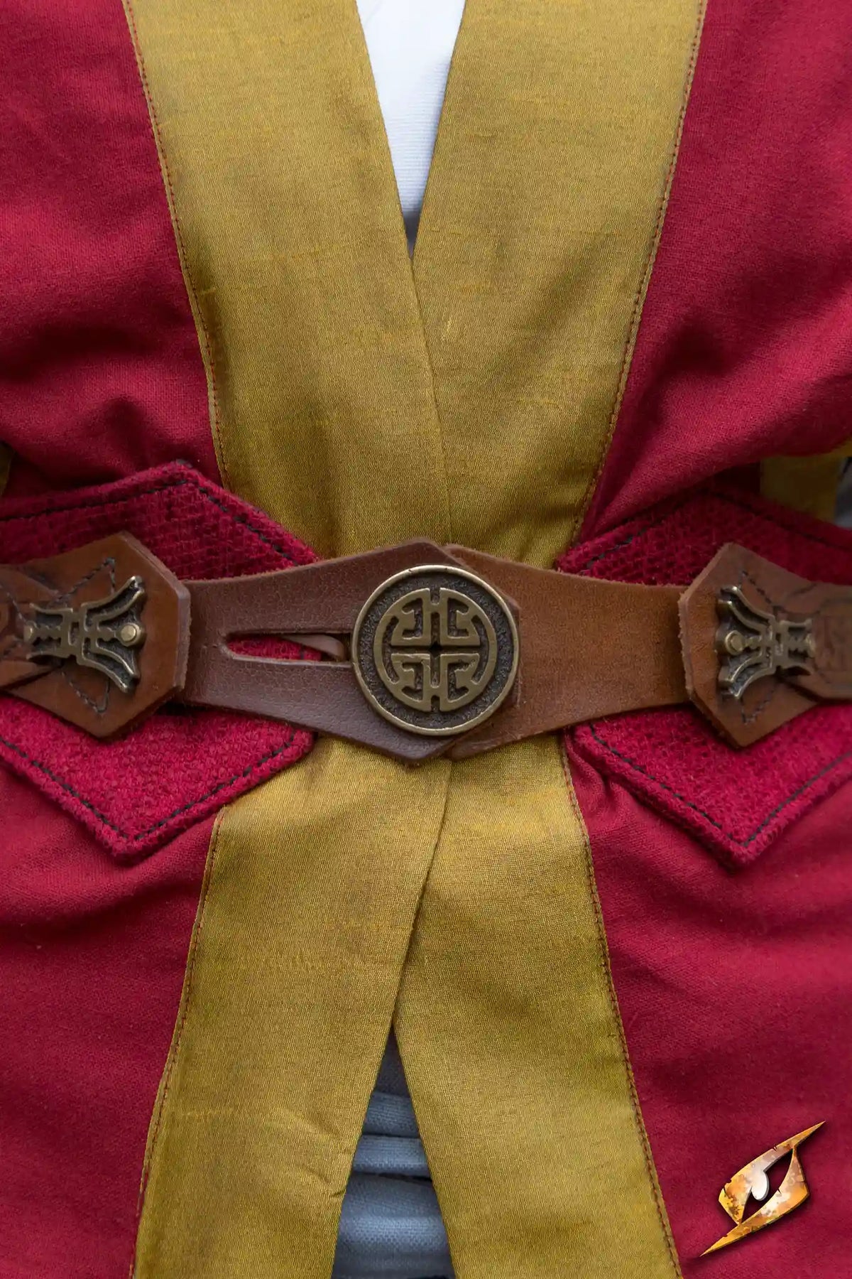 Beruto belt worn with red and yellow outfit, featuring intricate design and adjustable fit for LARPing.