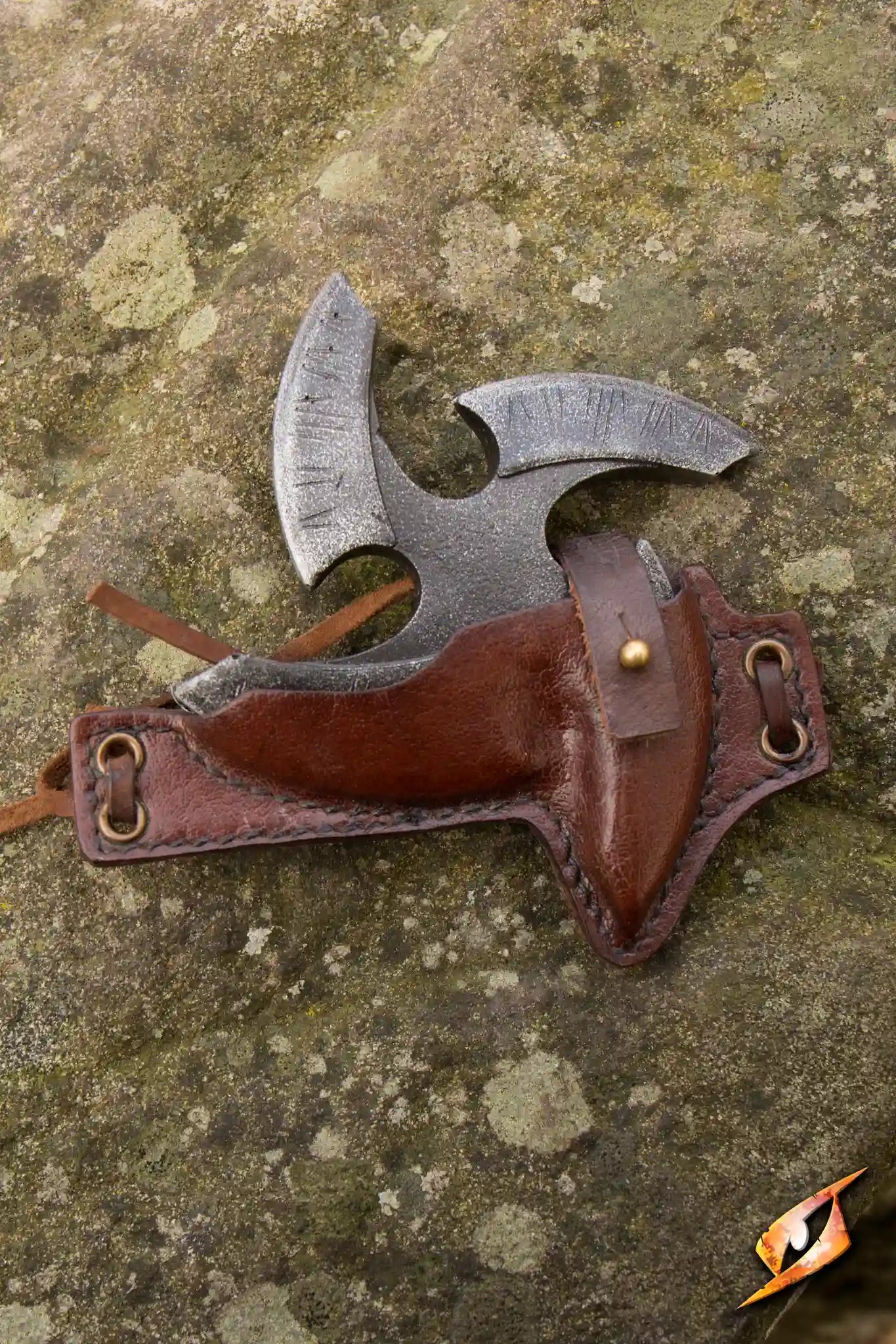 Black Shuriken & Holder displayed on a textured surface, showcasing its leather holder and metal shuriken design.