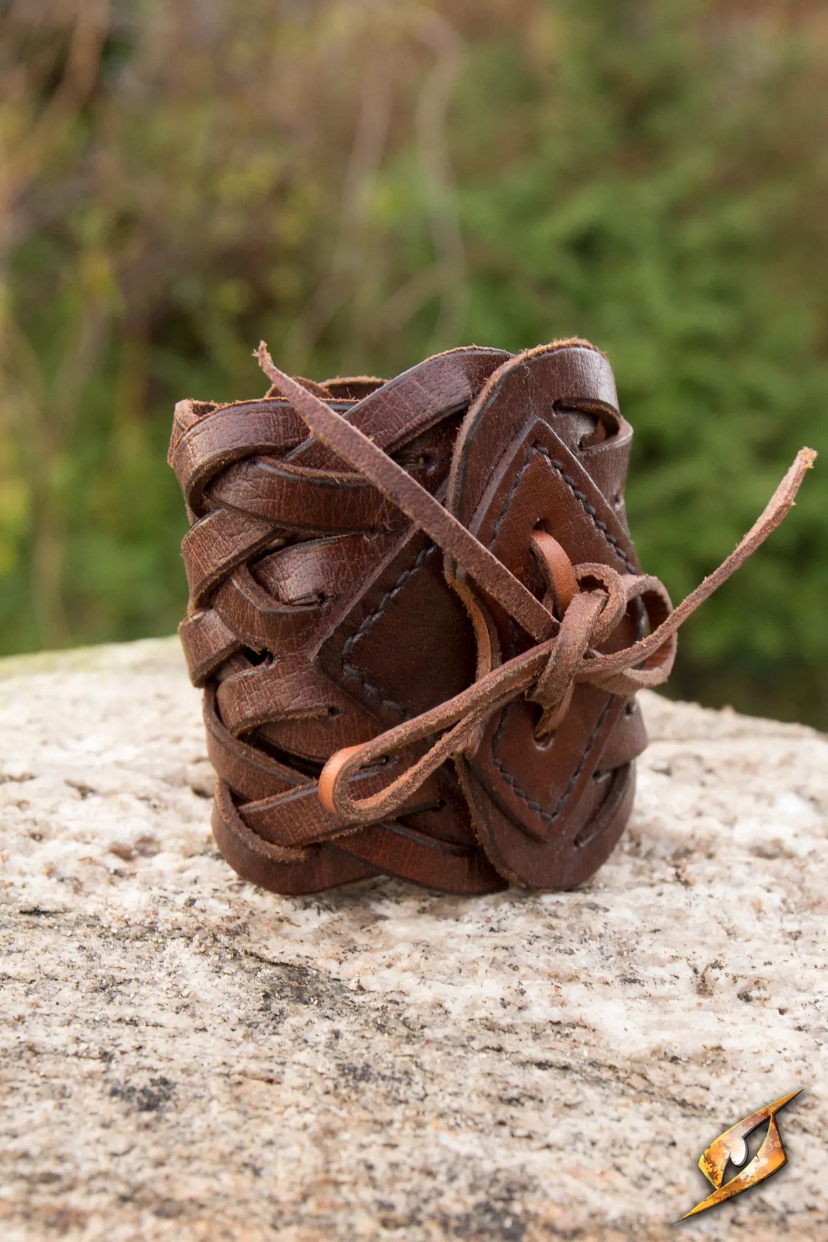 Braided Bracelet made of intricate leather braids, featuring a diamond-shaped brace and tied leather cord.