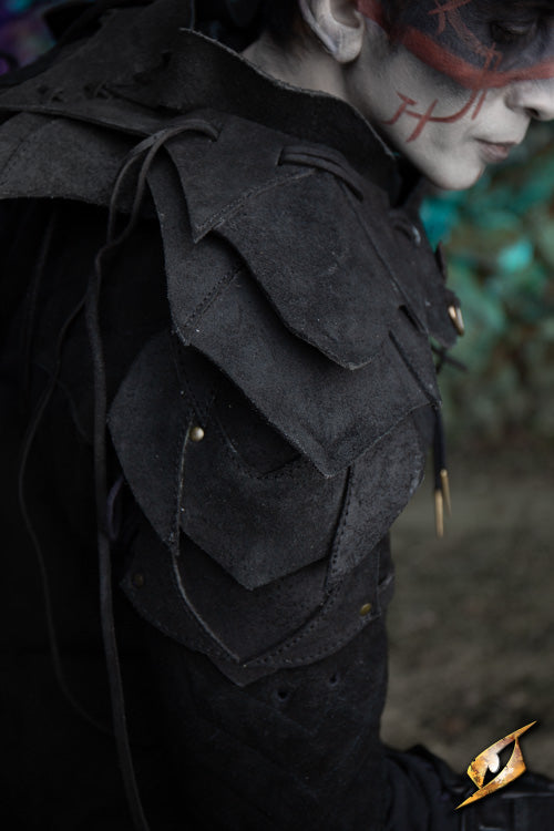 Model showcasing the Shadow Armour Set - Suede with detailed layered shoulder design in a natural setting.