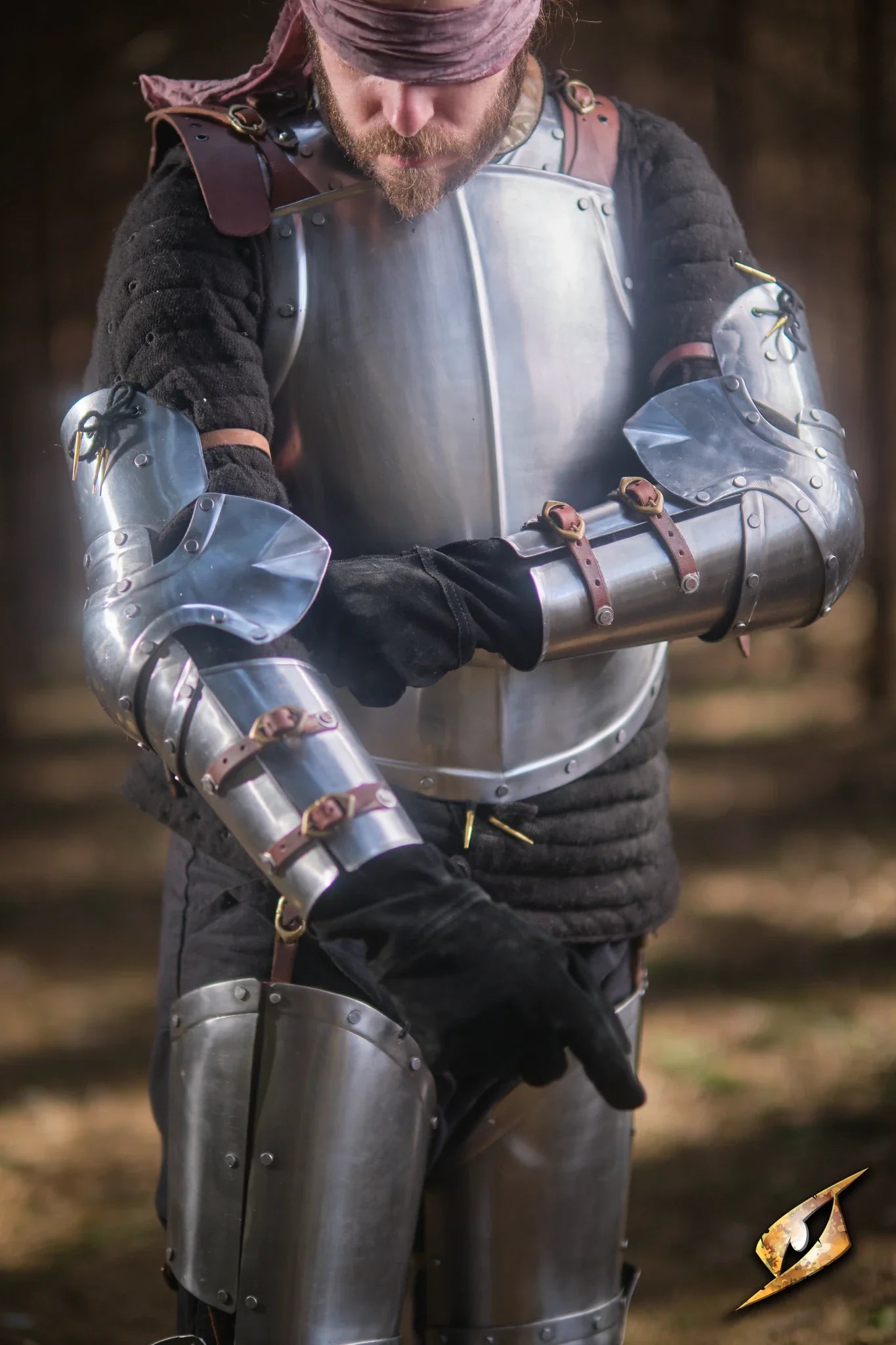 Captain Arm Protection worn by a warrior, showcasing polished steel armor and leather straps for comfort.
