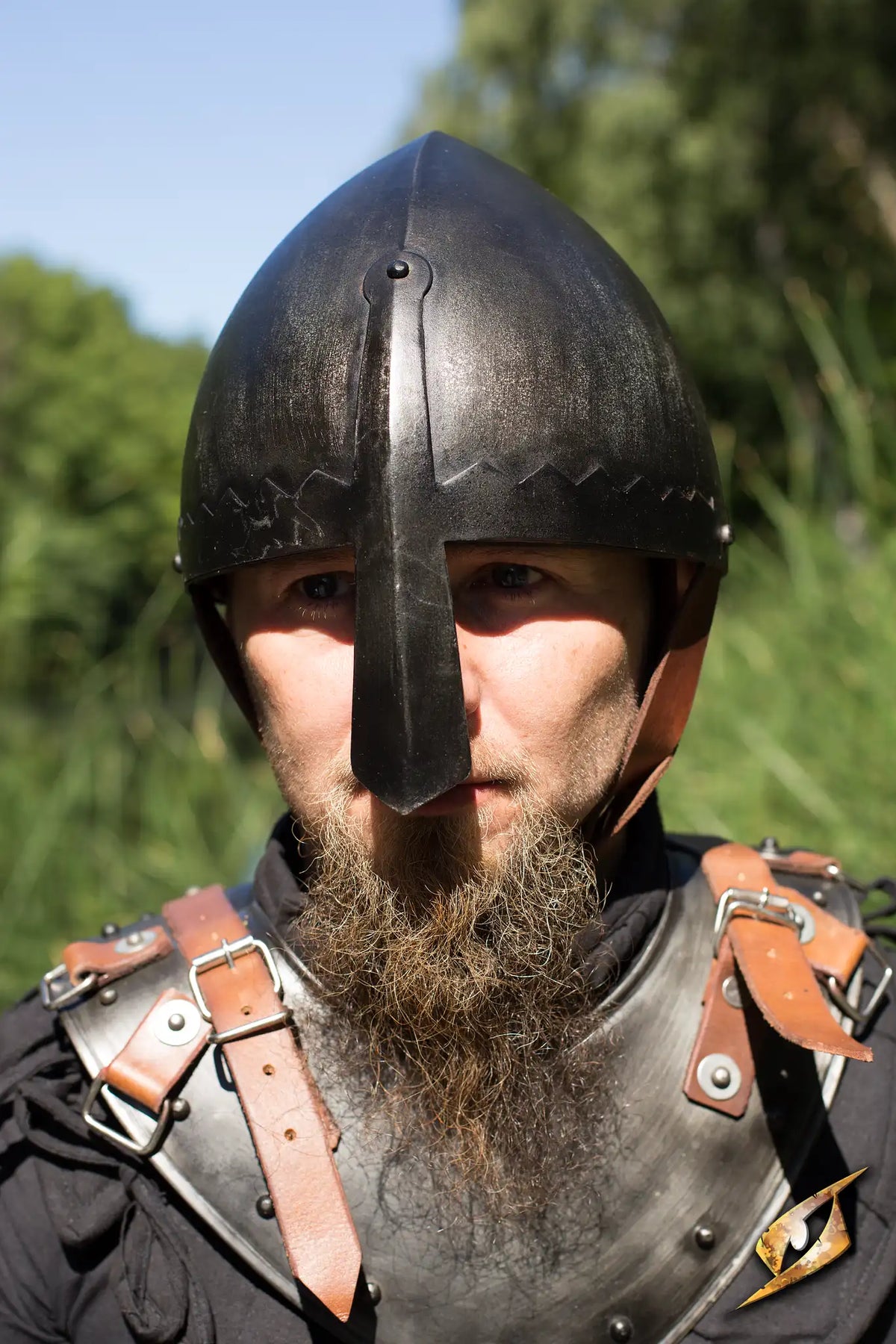 Front view of a wearer in the Epic Dark Norman Nasal Helmet with conical skull cap.