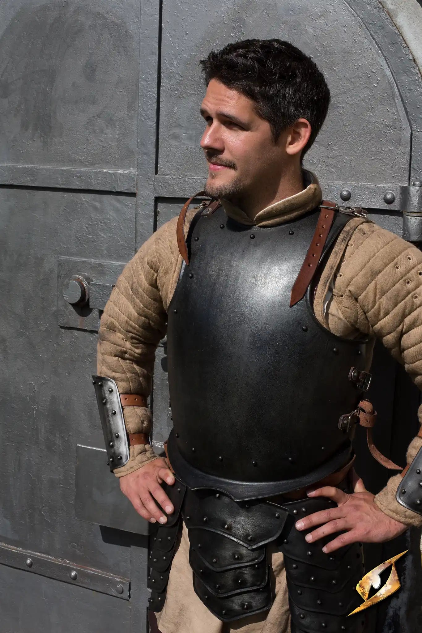 Breast Plate Warrior worn by a man, showcasing a dark, sculpted breastplate armor in a medieval setting.