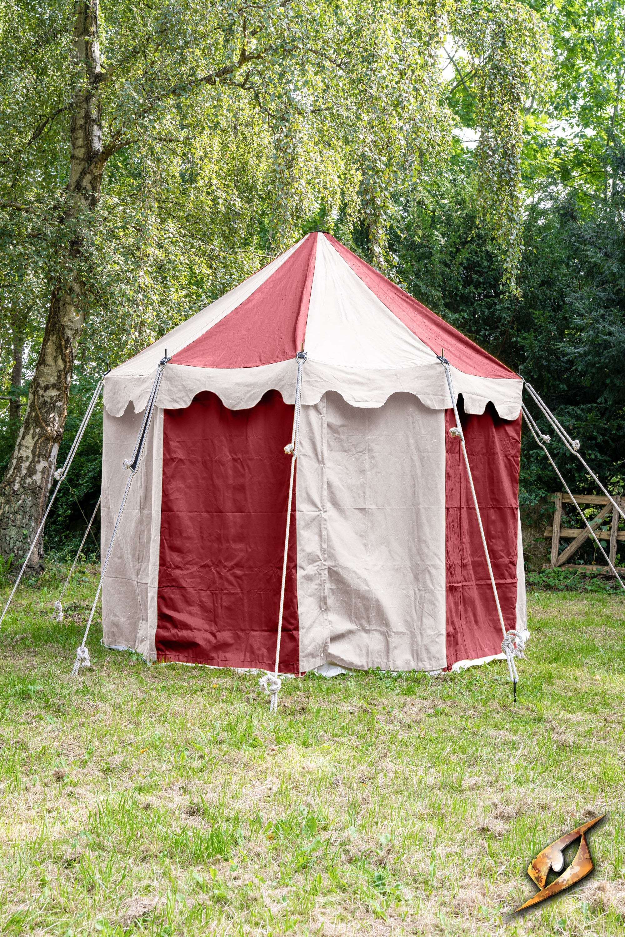 Round Pavilion Tent - 3m set up in a green field with red and beige canopy on sunny day.