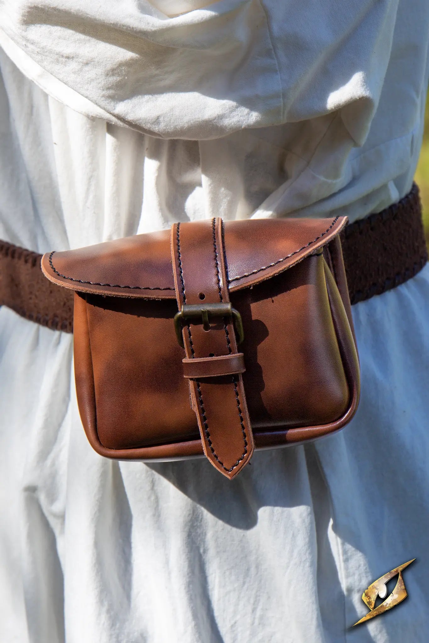 Warrior Bag - Faux Leather - Small in ox brown, attached to a belt with a sturdy brass-buckled strap.