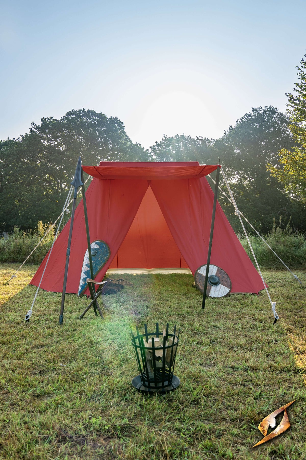 Double Wedge Tent - 3x5 m set up in a sunny campsite with a fire pit in front.