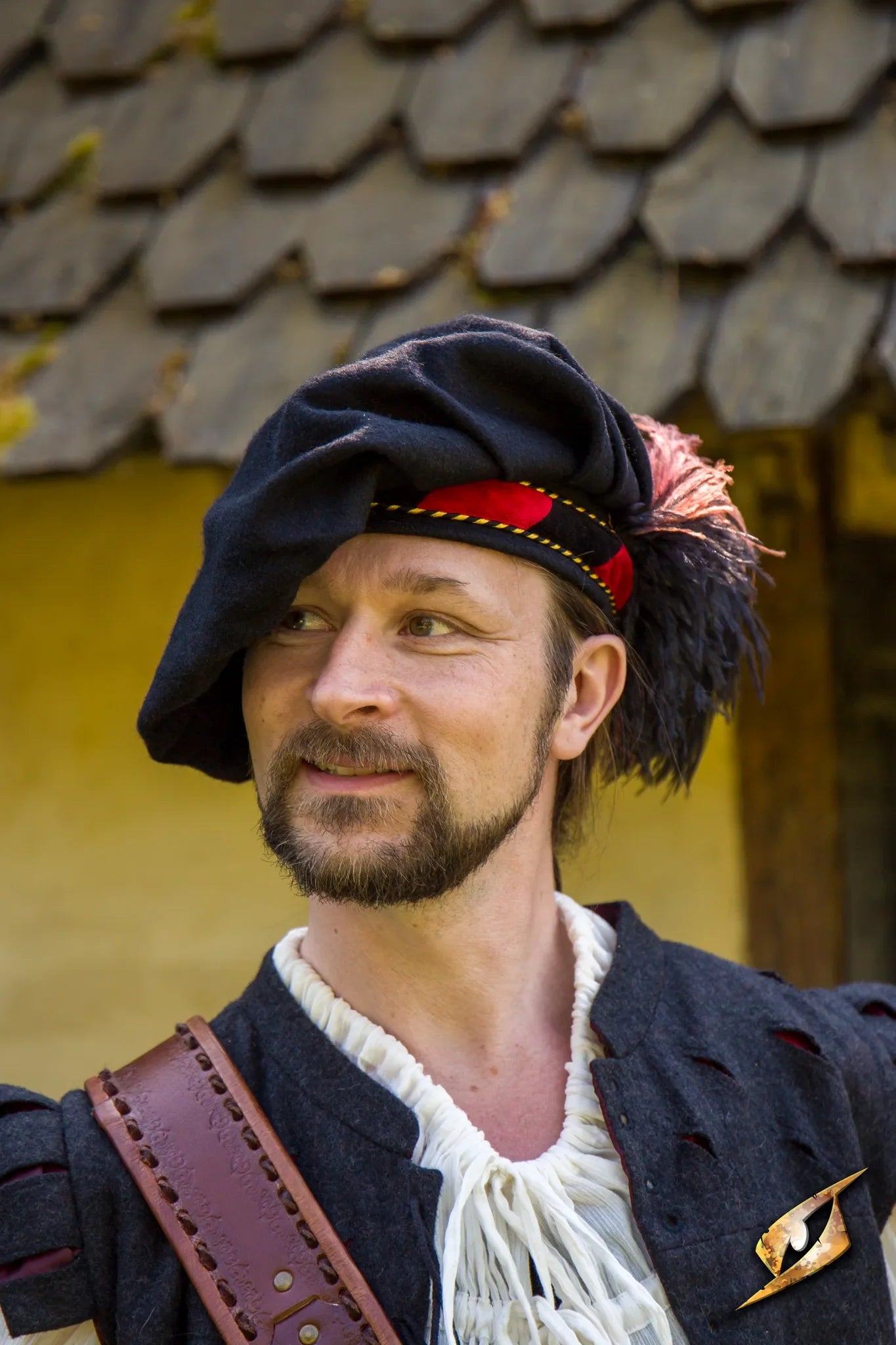 Wool Minstrel Hat worn by a man in historical attire, showcasing its unique design and style.