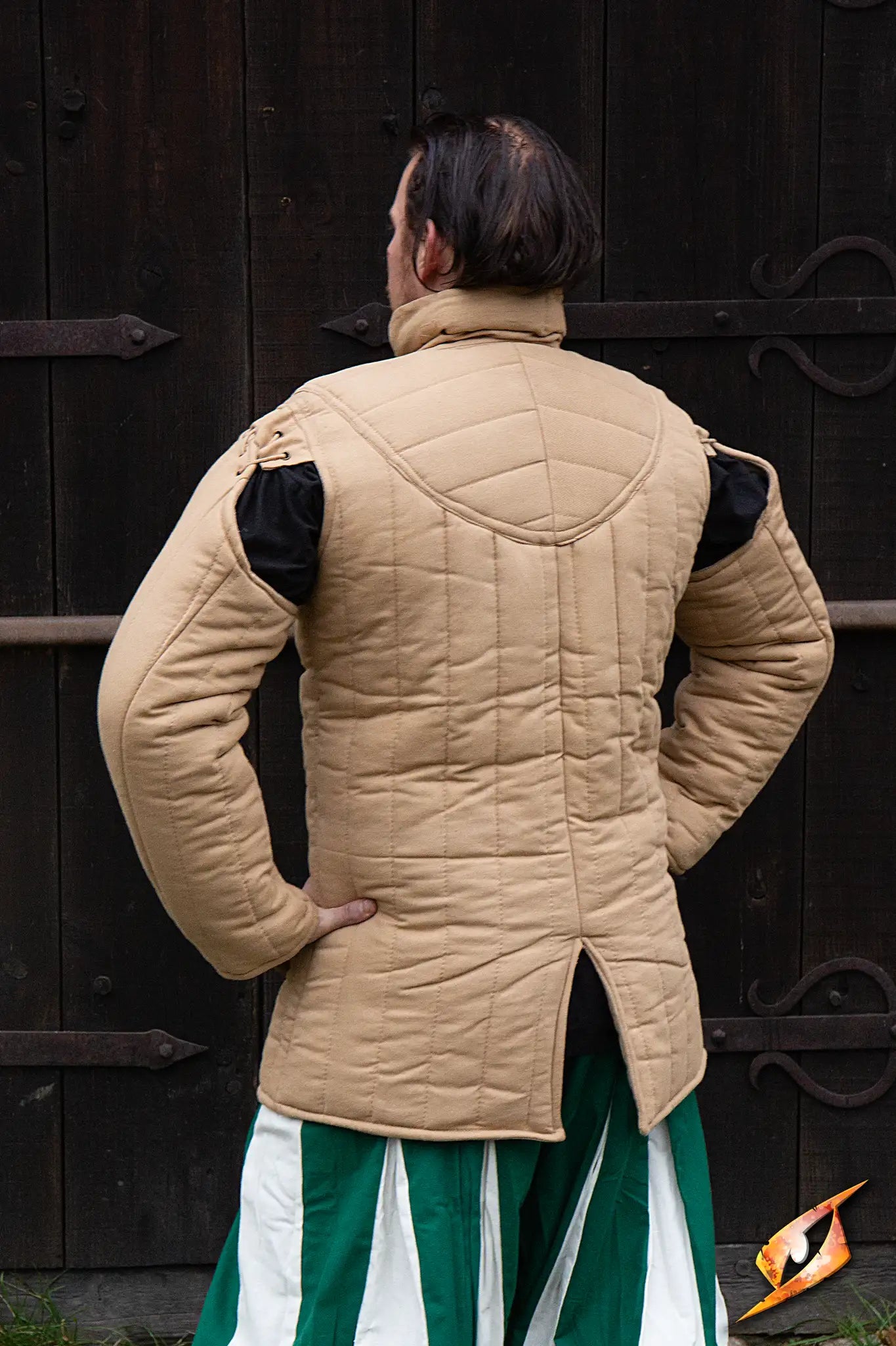 Gambeson Warrior With Long Sleeves worn by a man, showcasing the back design and quilted structure.
