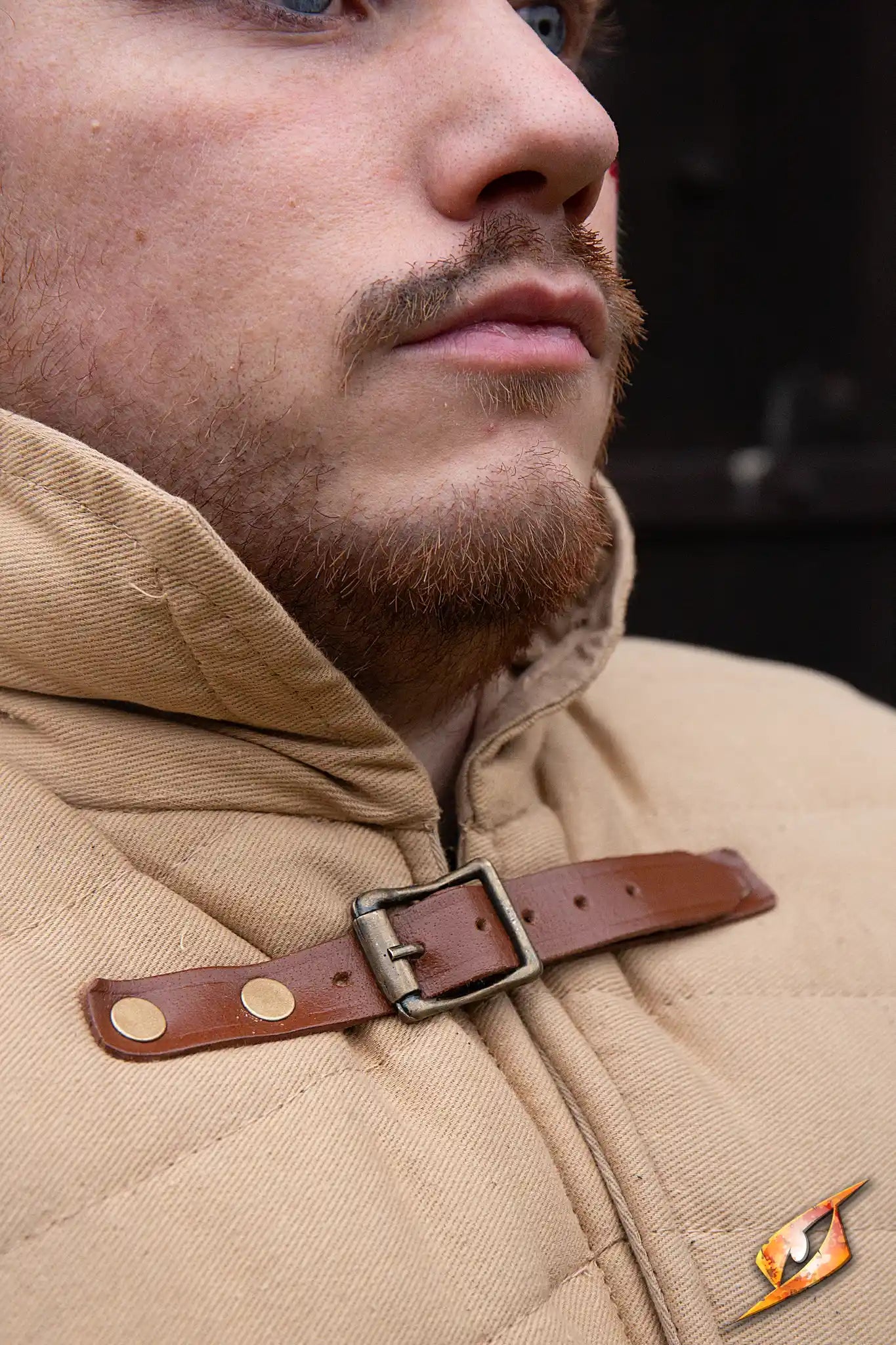 Gambeson Warrior With Long Sleeves featuring a man in a tan armor with a leather buckle collar.