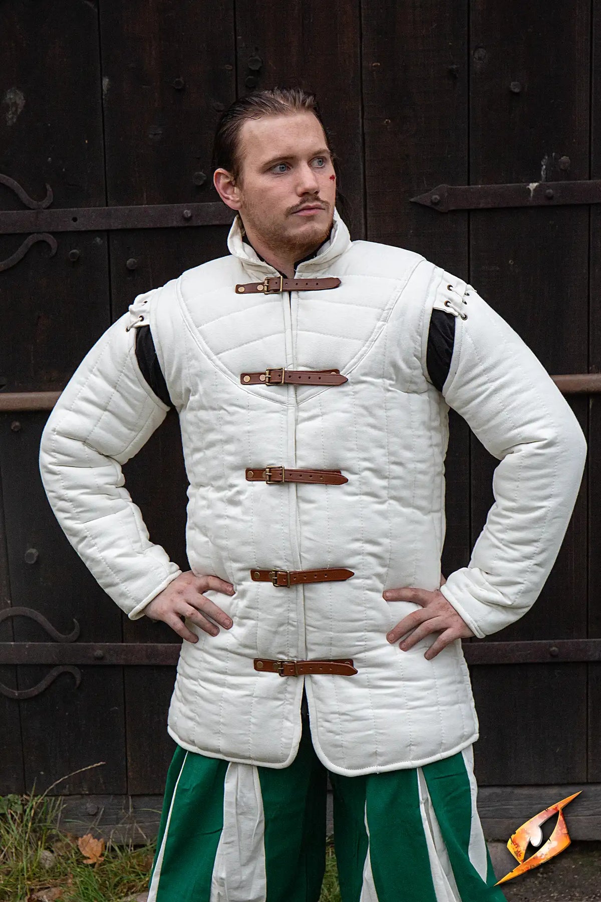Gambeson Warrior With Long Sleeves worn by a model, featuring side buckles and a warm, quilted design.