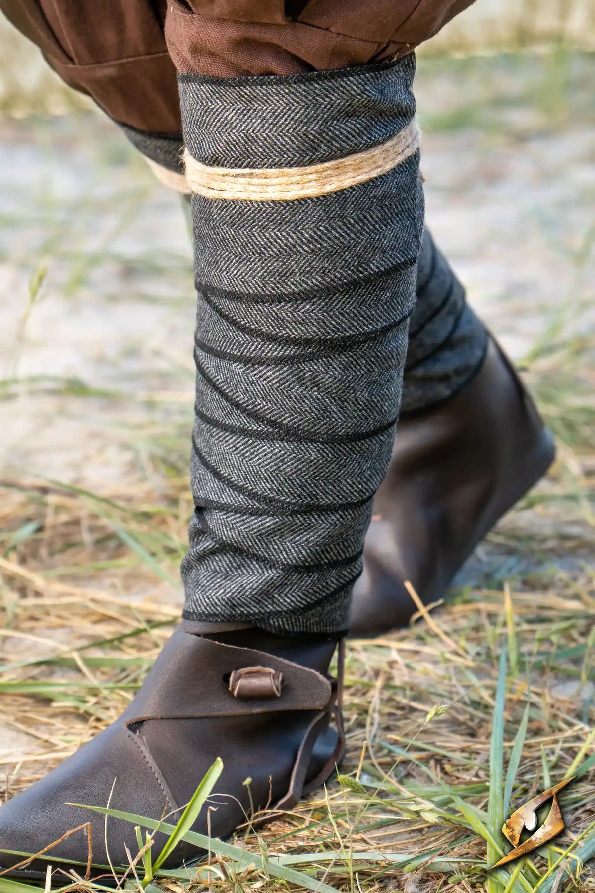 Herringbone Leg Wraps worn by a warrior, featuring a durable herringbone pattern for Larp and period costumes.