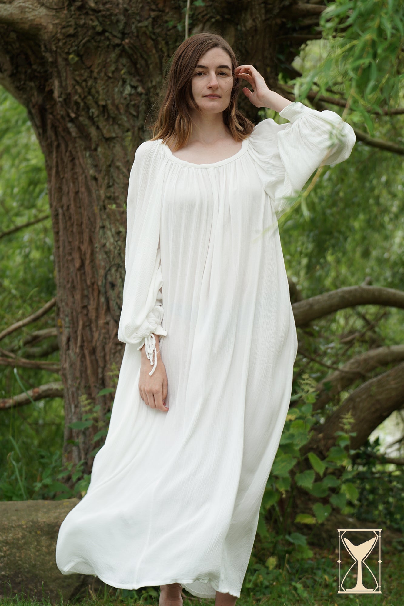 Model wearing the Shift Giulia historical costume, showcasing its elegant white design and flowing silhouette.