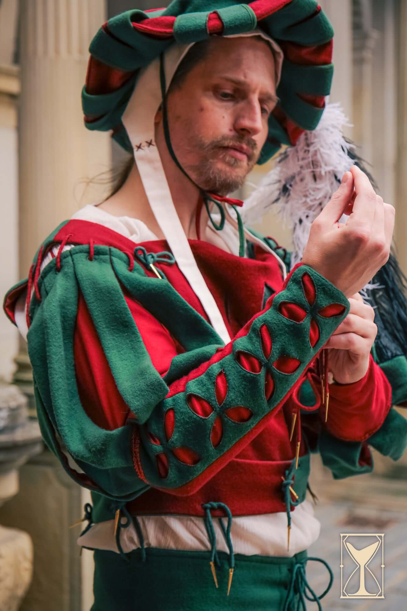 Man in Landsknecht Bloom Sleeve, featuring decorative slashes and petal motifs, showcasing structured elegance.