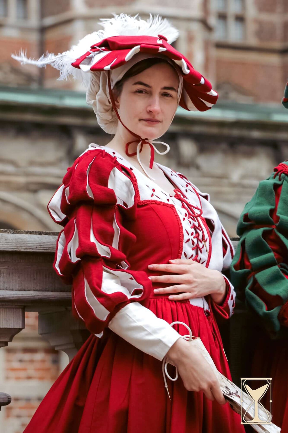 Landsknecht Waterfall Sleeve, a historical costume featuring bold slashed sleeves and luxurious red fabric.