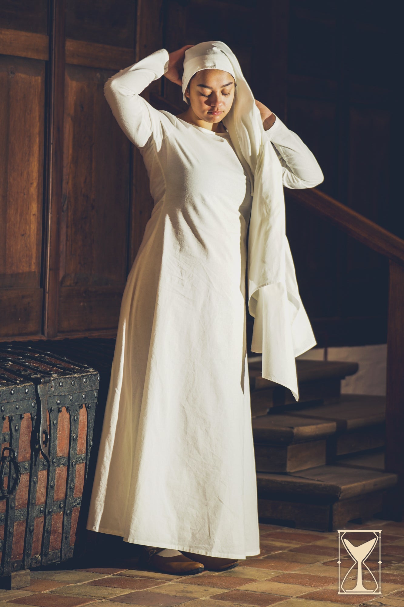 Woman wearing a white Chemise from the Yoremade collection by Epic Armoury, suitable for medieval outfits.