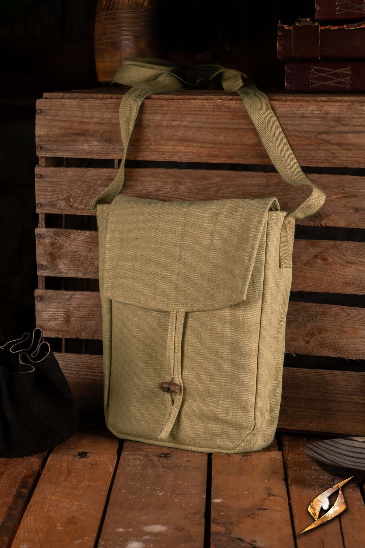 Traveler Satchel - Canvas displayed on wooden crate, showcasing its durable cotton material and simple design.