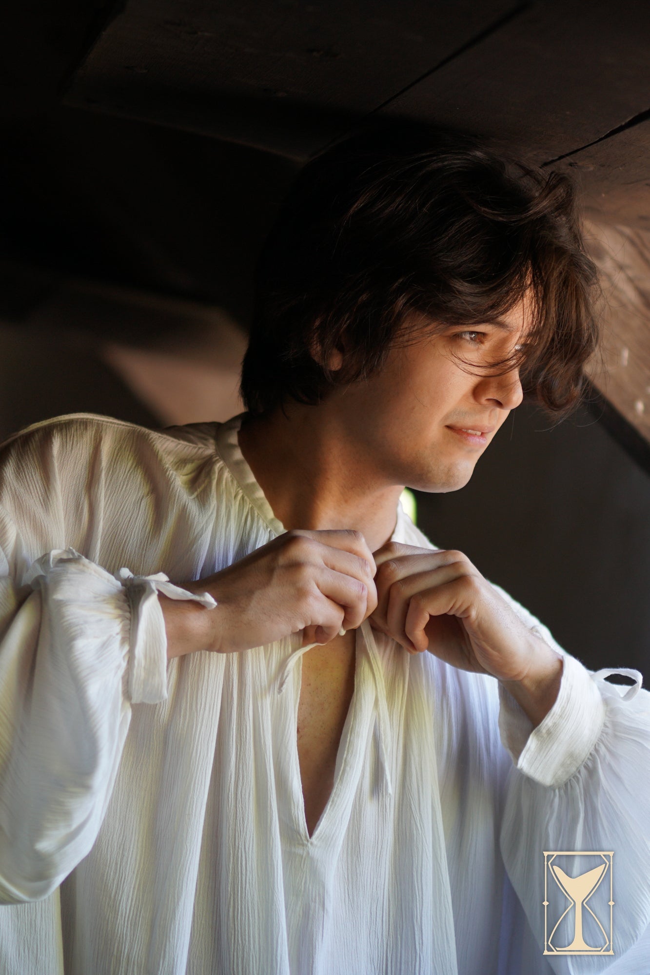 Man wearing Shirt Bartholomew, a relaxed-fit, classic piece of 13th-16th century apparel.