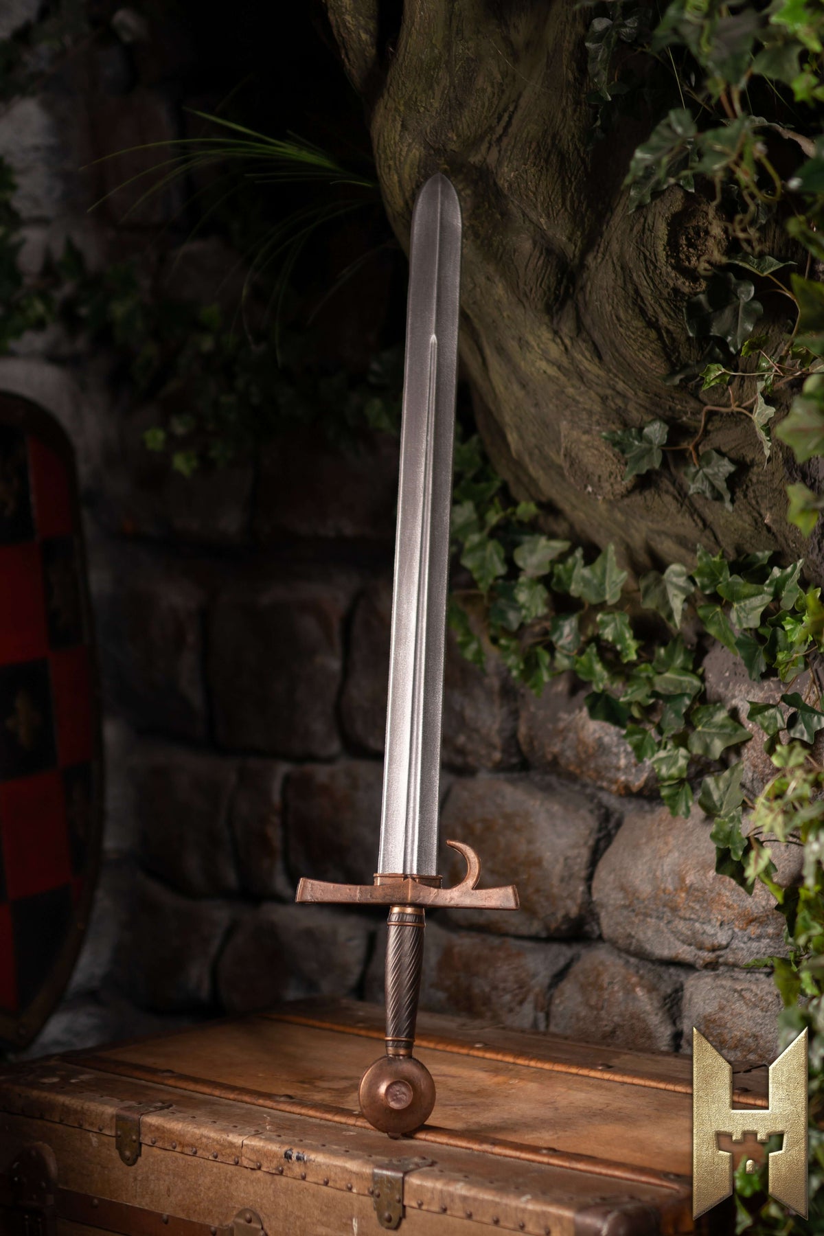 Milanese Sword displayed against a stone wall, showcasing its elegant design and durability from Epic Armoury.