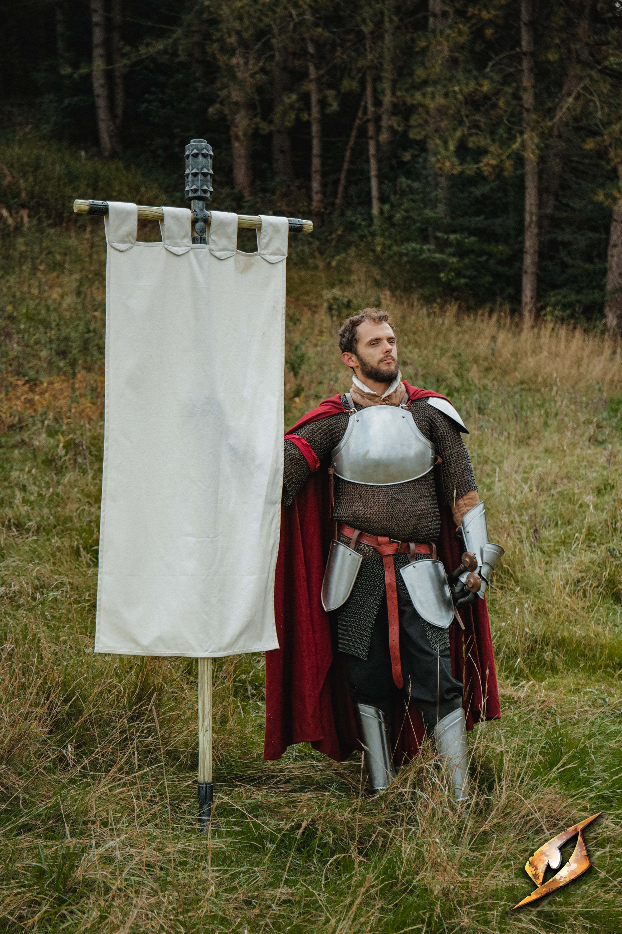 Complete Battle Standard Set - Spiked Mace Top displayed by a knight in armor with a banner in a forest.